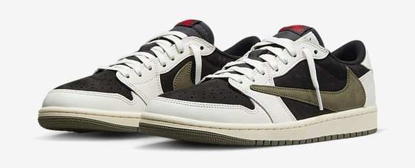 Side view of white, black, and green Jordan sneakers.